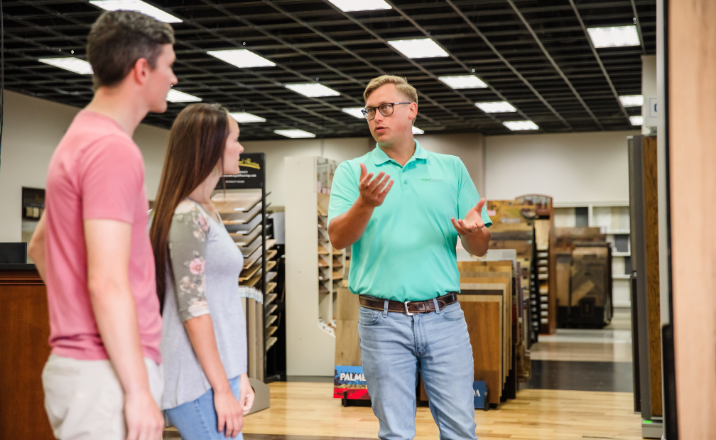 Employee helping customemrs